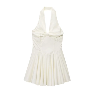 White halter neck sleeveless pleated dress with a cinched waist shown in a flat lay view