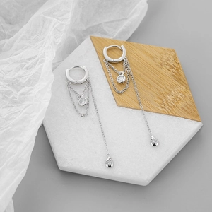 Elegant S925 silver fringe drop earrings with sparkling cubic zirconia on marble base