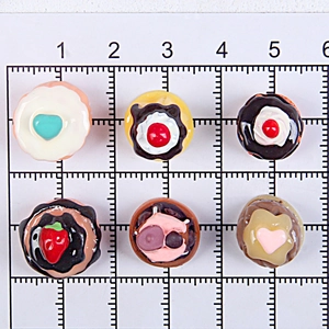 Miniature resin resin vanilla chocolate cakes and donuts with grid ruler measurement