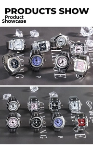 Close-up of creative alloy ring watches in various colors on decorative ice cubes