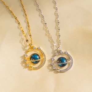 Gold and silver celestial planet pendant necklaces with blue orbs and zircon star rings