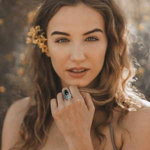 Close-up of a vintage bohemian alloy ring with a black gemstone and marcasite inlay