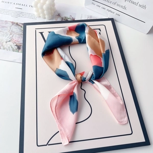 70cm square silk satin scarf with abstract ink print draped in a luxury lifestyle setting