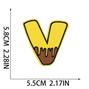 Detailed view of yellow and brown embroidered letter V bee patch with size dimensions