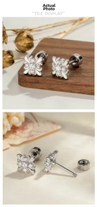 Detailed view of silver iris flower stud earrings with sparkling crystals and screw back