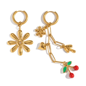 Detail of asymmetric cherry and floral earrings in 18K gold with enamel charms