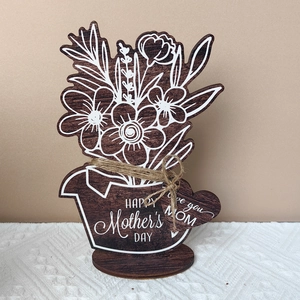 Detail of wooden Mother's Day flower ornament with heart tag and Happy Mother's Day text