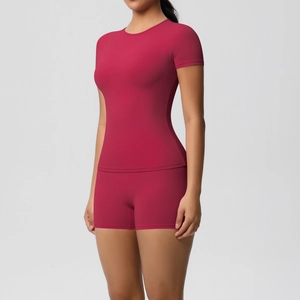 Close-up of magenta high-stretch short sleeve top and high waist sports shorts set