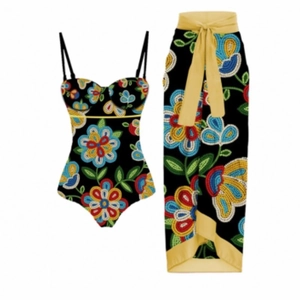 Detail view of two-piece floral bikini set with matching sarong and yellow waist tie