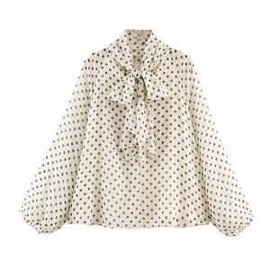 Elegant white chiffon blouse with black polka dots and oversized bow collar detail