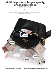 Detail showing the large capacity of the black leather backpack with multiple storage pockets