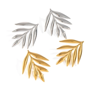 Leaf shaped stainless steel stud earrings in gold and silver finish on white background