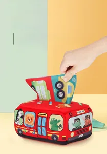 Detail of red school bus tissue box toy with printed fabrics for infant early learning