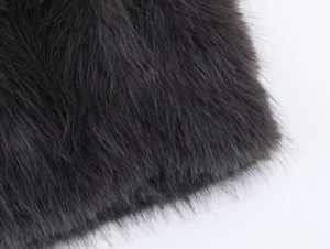 Macro shot of charcoal grey faux fur material showing high-density soft texture detail