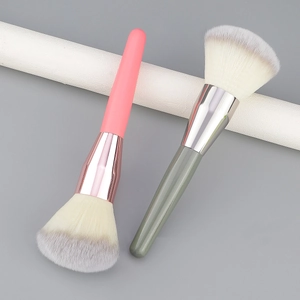 Large fluffy powder and blush brushes with soft synthetic bristles and metallic ferrules