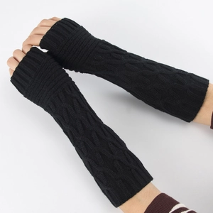 Close-up of black cable knit arm warmers showing texture and fingerless design