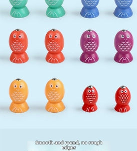 Detailed view of colorful wooden magnetic fish in various vibrant colors for kids toys