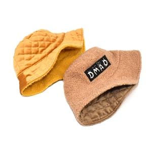 Quilted bucket hat detail showing ginger and brown colors with soft fleece lining