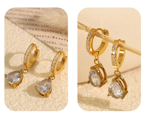 Détail de boucles d'oreilles goutte en or 18K avec zircone cubique et cristaux pavés