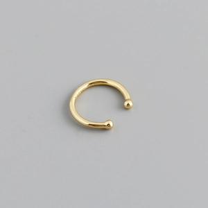 Close-up of golden S925 sterling silver ear cuff showing the engraved hallmark and smooth beads