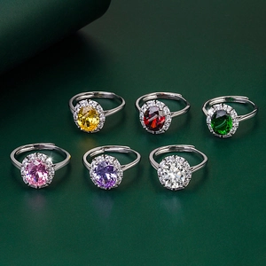 Detailed grid of oval gemstone rings in six colors with adjustable silver bands