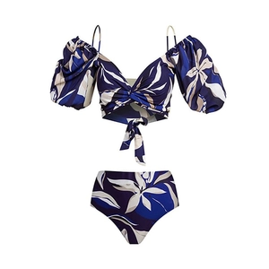 Detail of high-waist bikini bottoms and off-shoulder top with tropical leaf print
