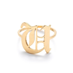 Detail view of gold adjustable ring featuring a gothic letter D with hollow design