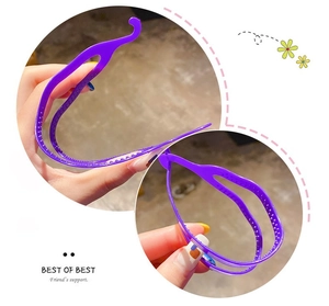 Detail showing flexible purple plastic headband with non-slip teeth for comfortable styling