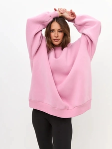 Detail view of the soft pink fleece fabric and cozy knit texture of the casual sweatshirt