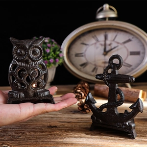 Vintage cast iron owl candle holder and anchor decor with rustic bronze finish