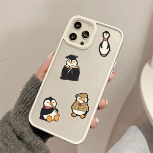 Detail of penguin doodle stickers on a silicone iPhone case with cartoon animal designs