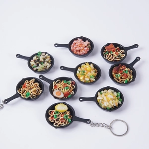 Miniature food pan keychains featuring realistic fried rice and noodles charms