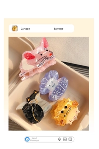 Detailed close-up of cute cartoon animal hair claws in a beige textured display box