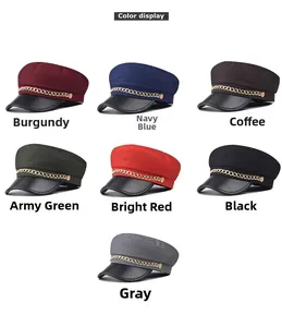 Color options of baker boy caps featuring textured fabric and gold chain detail