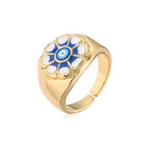 Detailed side view of 18K gold plated flower ring with blue evil eye enamel and adjustable band