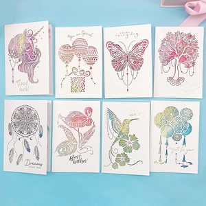 Detail of 3D pop-up greeting cards with laser-cut unicorn and flamingo designs
