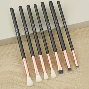Close-up of 7-piece makeup brush set with rose gold ferrules and soft synthetic bristles