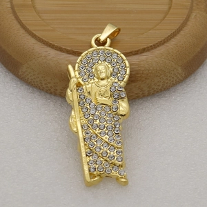 Detailed view of Saint Jude religious pendant with gold plating and sparkling rhinestones