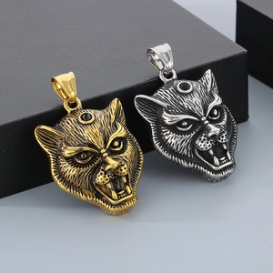 Detailed macro view of hip hop style three-eyed leopard pendants in gold and silver finish