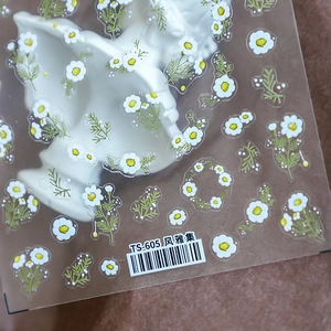 Minimalist daisy and chamomile nail art stickers with white petals and yellow centers