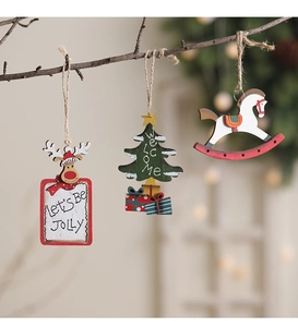 Detailed view of rustic wooden Christmas ornaments hanging from branches on hemp ropes