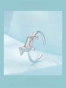 Macro detail of 925 sterling silver golden retriever dog ring with fine fur textures