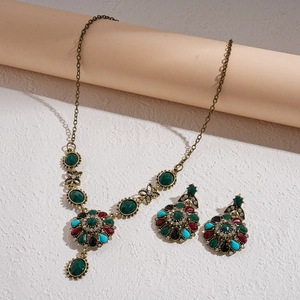 Vintage jewelry set with green stones, bronze necklace and earrings in royal style