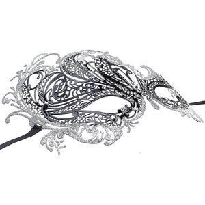 Detail of silver filigree masquerade mask with glitter coating and black silk ribbons