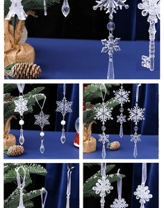 Macro detail of acrylic snowflake and key ornaments with festive silk ribbons