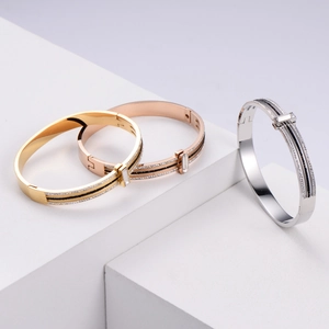 Set of gold silver and rose gold stainless steel hinged bangles with zircon crystals