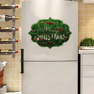 Detailed view of Merry Christmas vinyl stickers on a white refrigerator surface