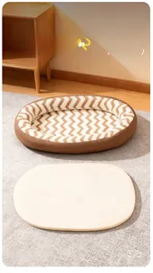 Macro view of warm chevron pattern pet bed with removable zipper and soft beige cushion