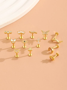 Detailed set of twelve gold-plated piercing studs with zirconia hearts and stars motifs
