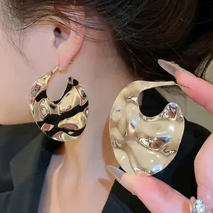 Silver plated irregular geometric hoop earrings with hammered wave texture for women